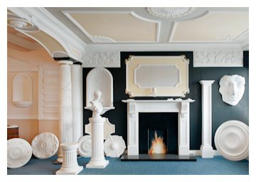 Solid white marble fireplace, panel moulds, roman niche and marbleized Harewood flutted columns.